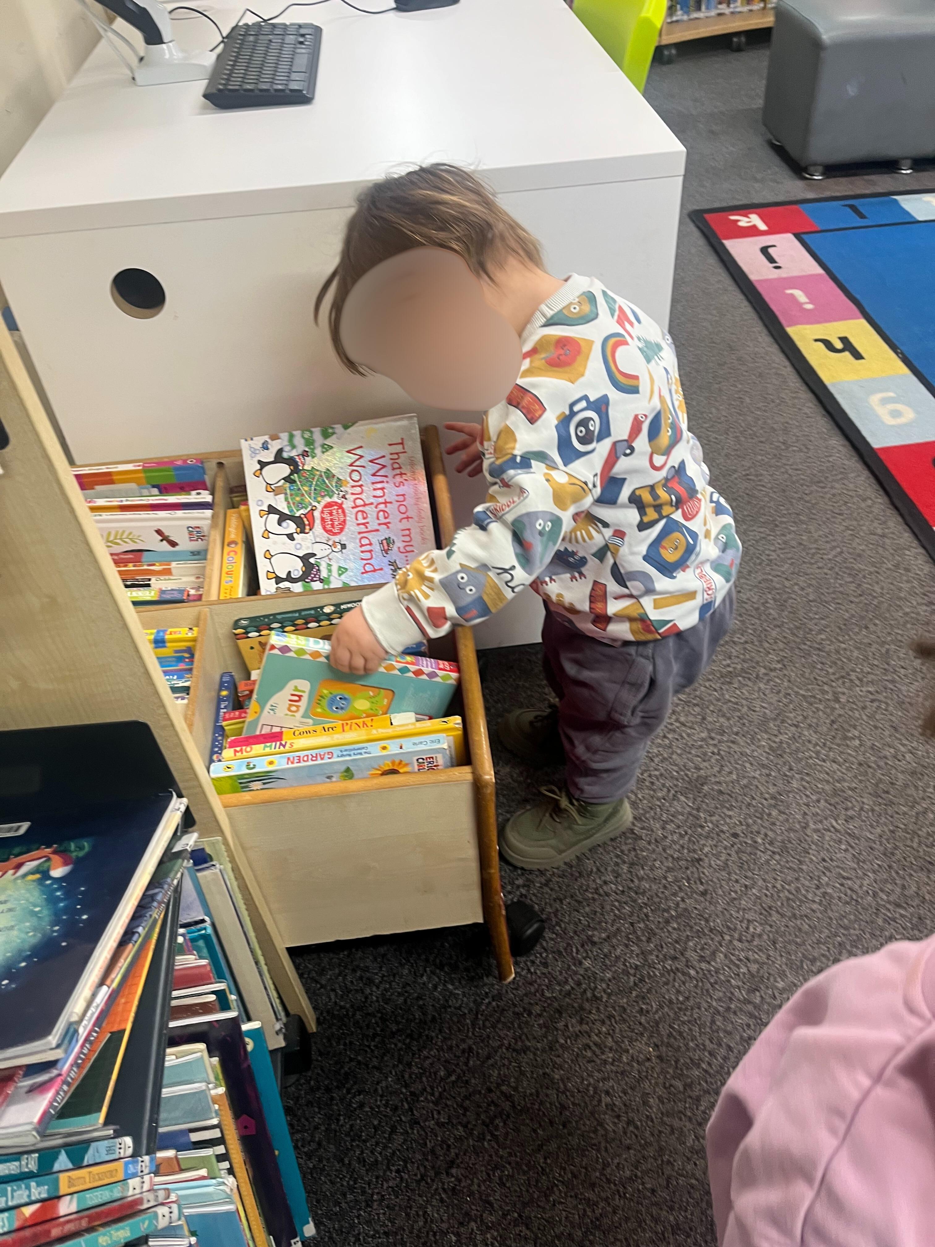 Reading corner with books and cushions